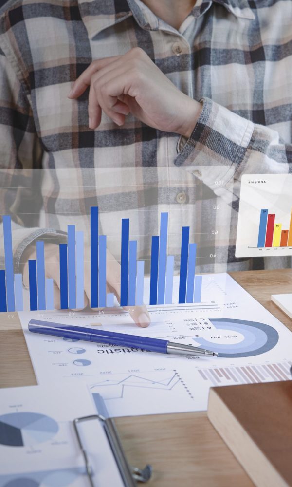 Businesspeople working in finance and accounting Analyze financi Businesspeople working in finance and accounting Analyze financial graph budget and planning for future in office room.